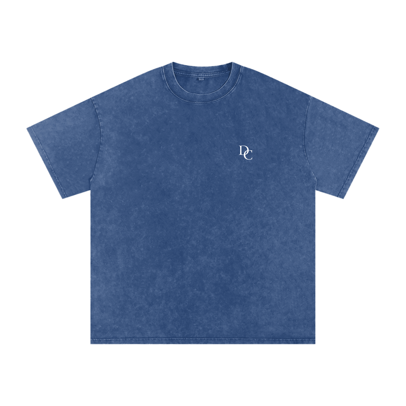 Don Chevere Asphalt Oversized Essential Tee, a washed blue 100% cotton t-shirt with a relaxed fit and subtle white DC logo on the chest.