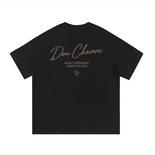 Don Chevere black 100% cotton t-shirt with gold text logo and graphic print on back.