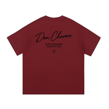 Don Chevere black short sleeve 100% cotton unisex t-shirt with round neck and graphic print on back.