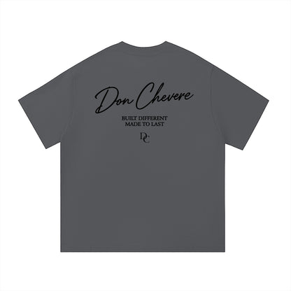 Don Chevere black 100% cotton unisex t-shirt with round neck and short sleeves, featuring a graphic print on the back.