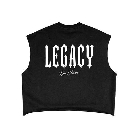 Don Chevere black cotton blend sleeveless cropped tank top with white 'LEGACY' graphic and distressed hem.
