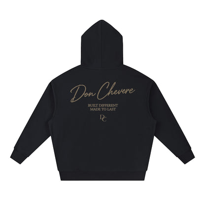 Don Chevere black cotton blend unisex drop-shoulder hoodie with gold text logo and graphic print on back.