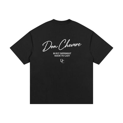 Don Chevere black 100% cotton oversized heavy tee with white text graphic on back.