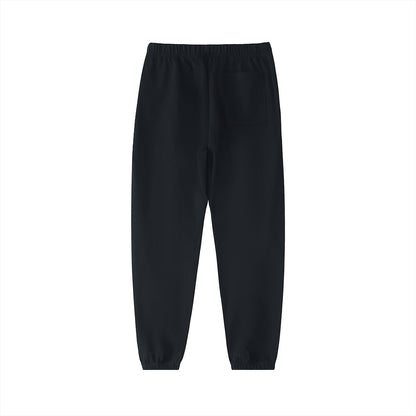 Don Chevere black heavyweight cotton sweatpants with a mid-waist and drawstring. Casual, sporty style.