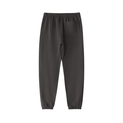 Don Chevere Essential Heavyweight Cotton Sweatpants in charcoal grey with a single back pocket and elasticated cuffs.
