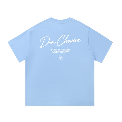 Don Chevere light blue 100% cotton short sleeve t-shirt with white text graphic on back.