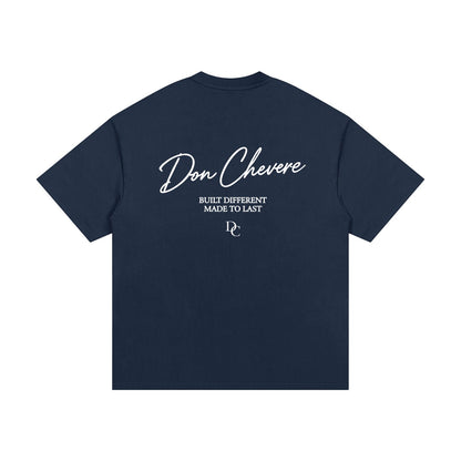 Don Chevere navy blue 100% cotton oversized heavy tee with white text graphic on back.