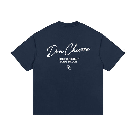 Don Chevere navy blue 100% cotton oversized heavy tee with white text graphic on back.