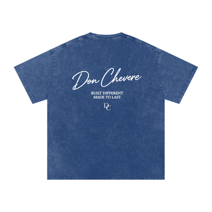 Don Chevere oversized essential tee in washed blue 100% cotton with a crew neck and short sleeves. Features white text and logo.
