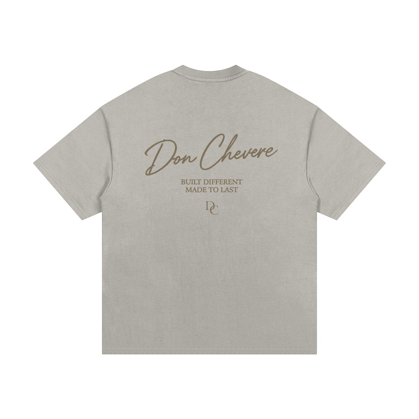 Don Chevere Essential Oversized Heavy Tee in gold, made from 100% cotton with a relaxed fit and drop shoulders.