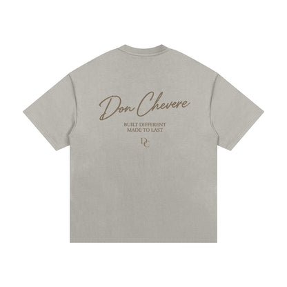 Don Chevere Essential Oversized Heavy Tee in gold, made from 100% cotton with a relaxed fit and drop shoulders.