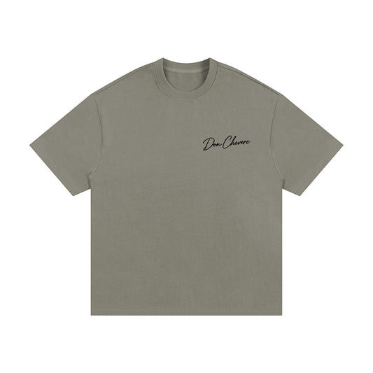 Don Chevere oversized heavy tee in muted green, 100% cotton with a crew neck and short sleeves.