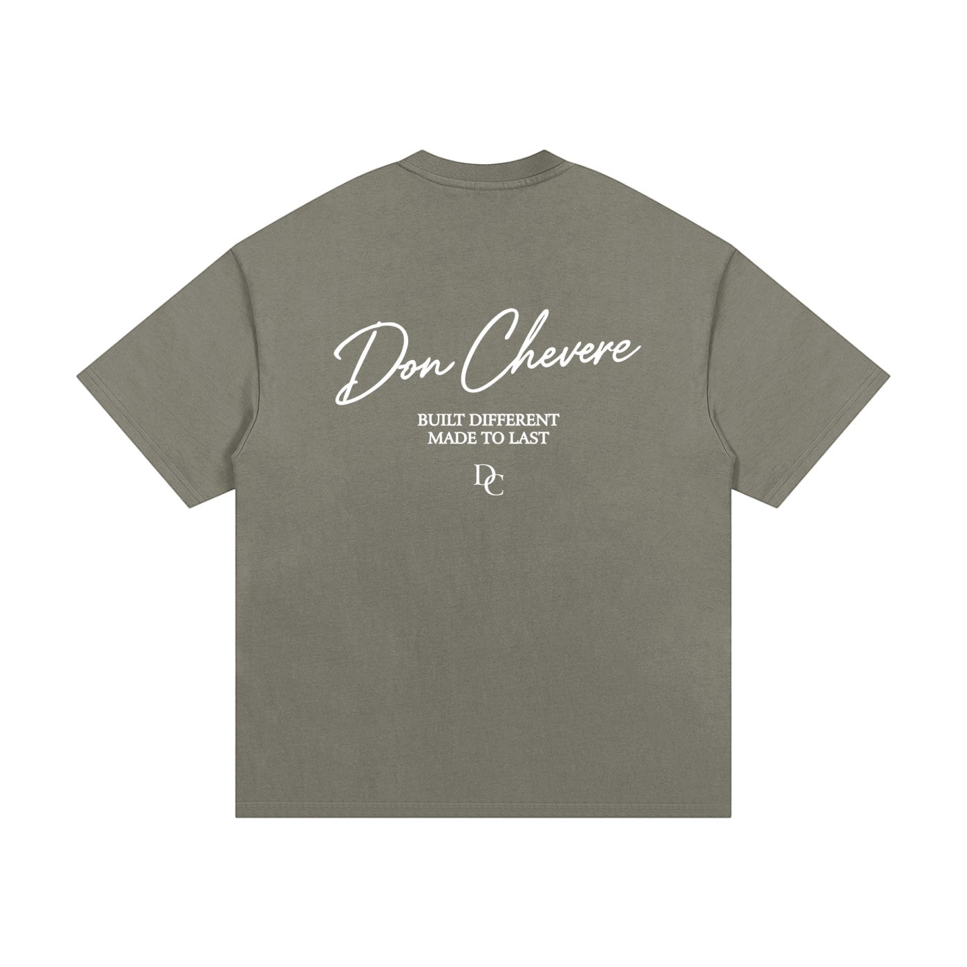 Don Chevere oversized heavy tee in olive green, made of 100% cotton with a crew neck and short sleeves. Features white text print on back.