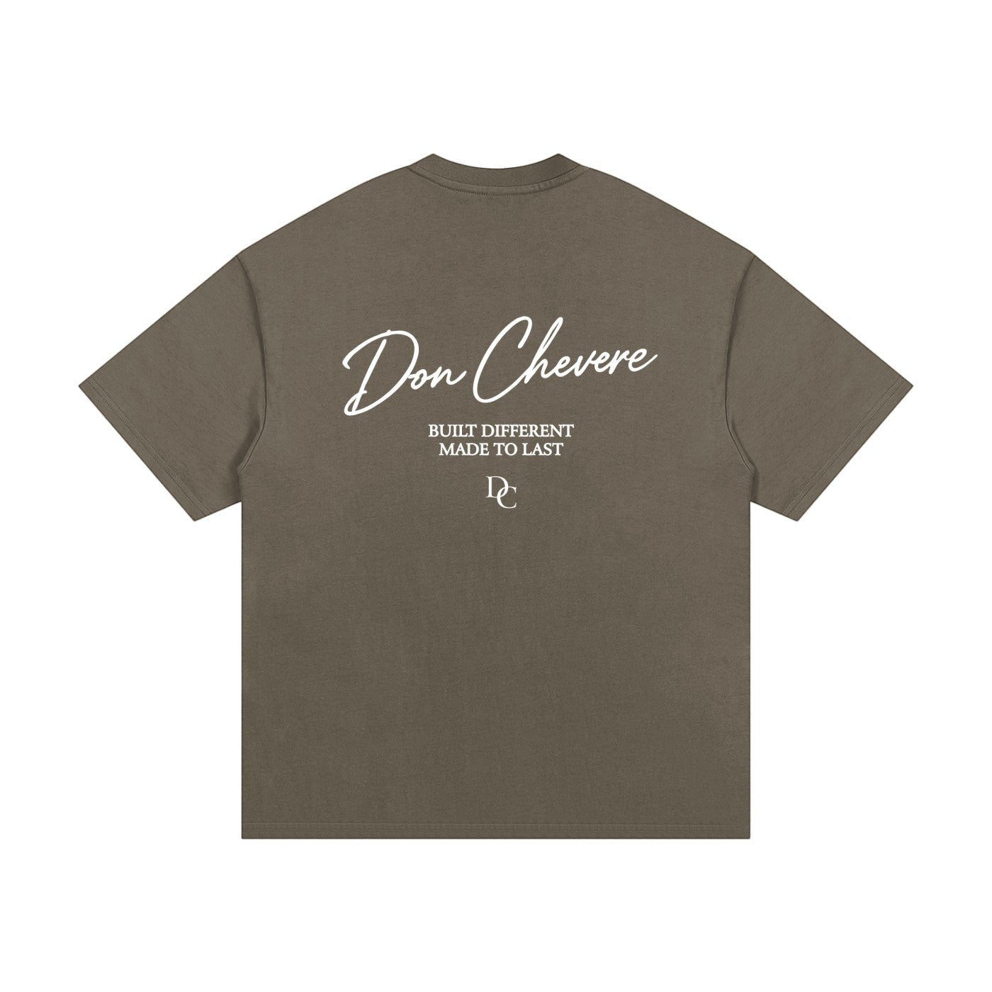 Don Chevere oversized heavy tee in taupe, made of 100% cotton with a round neck and short sleeves. Features a graphic print on the back.