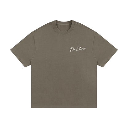 Don Chevere oversized heavy tee in taupe, made of 100% cotton with a crew neck and short sleeves. Features a subtle logo.