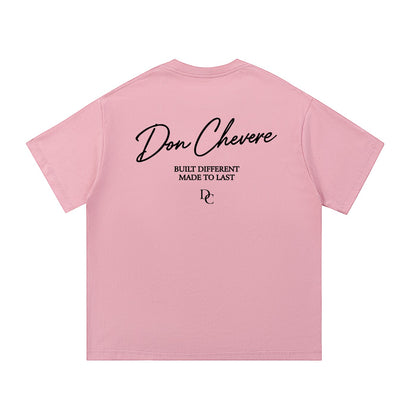 Don Chevere pink 100% cotton unisex short sleeve t-shirt with black text graphic on back.