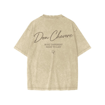 Don Chevere snow washed kids' tee in beige 100% cotton with short sleeves and round neck. Features text print.