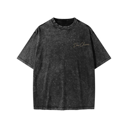 Don Chevere snow washed black 100% cotton kids' short sleeve t-shirt with round neck and subtle gold logo.