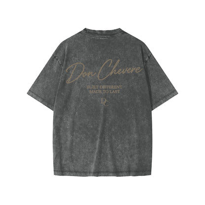 Don Chevere snow washed kids' tee, charcoal grey 100% cotton with short sleeves and round neck. Features a distressed graphic print.