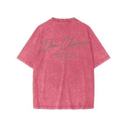Don Chevere snow washed kids' tee in pink, 100% cotton, short sleeves, crew neck, with graphic print on back.