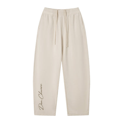 Don Chevere vintage wash loose sweatpants in beige, 100% cotton, with elastic waist, drawstring, and side pockets.