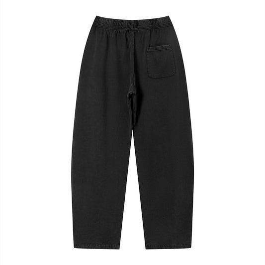 Don Chevere vintage wash loose sweatpants in black cotton with elastic waistband and single back pocket.