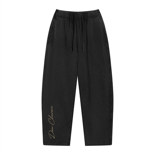 Don Chevere vintage wash loose sweatpants in black 100% cotton with elastic drawstring waist and side pockets.
