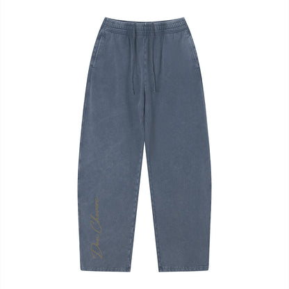 Don Chevere vintage wash loose sweatpants in blue cotton with elastic drawstring waist and embroidered logo on leg.