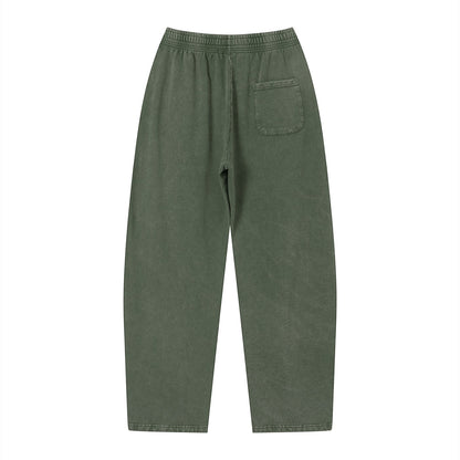 Don Chevere vintage wash loose sweatpants in olive green cotton with elastic waist and back pocket.