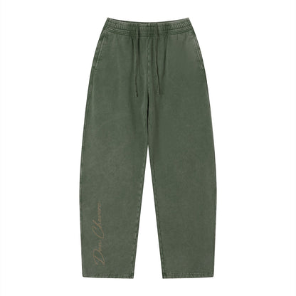 Don Chevere vintage wash loose sweatpants in olive green, 100% cotton with elastic drawstring waist and side pockets.