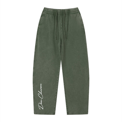 Don Chevere vintage wash loose sweatpants in olive green, 100% cotton with elastic drawstring waist and side pockets.