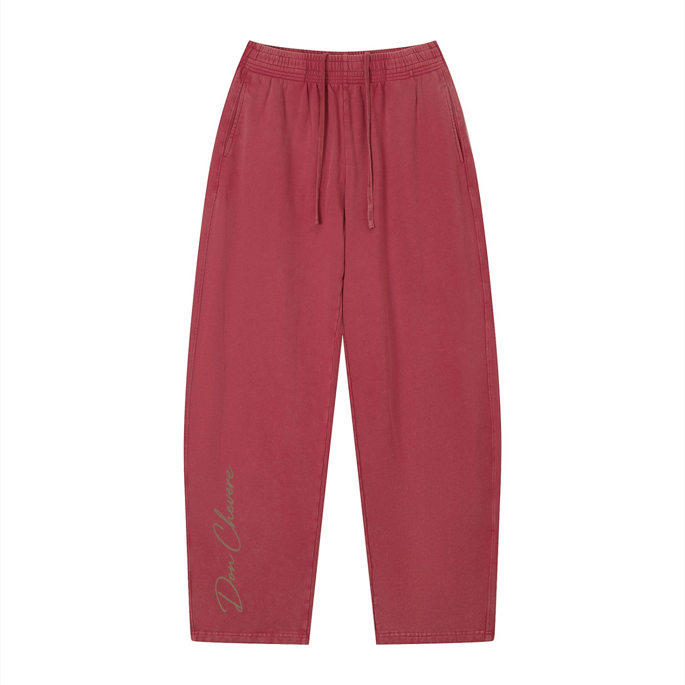 Don Chevere vintage wash loose sweatpants in red, made of 100% cotton with an elastic drawstring waist and side pockets.
