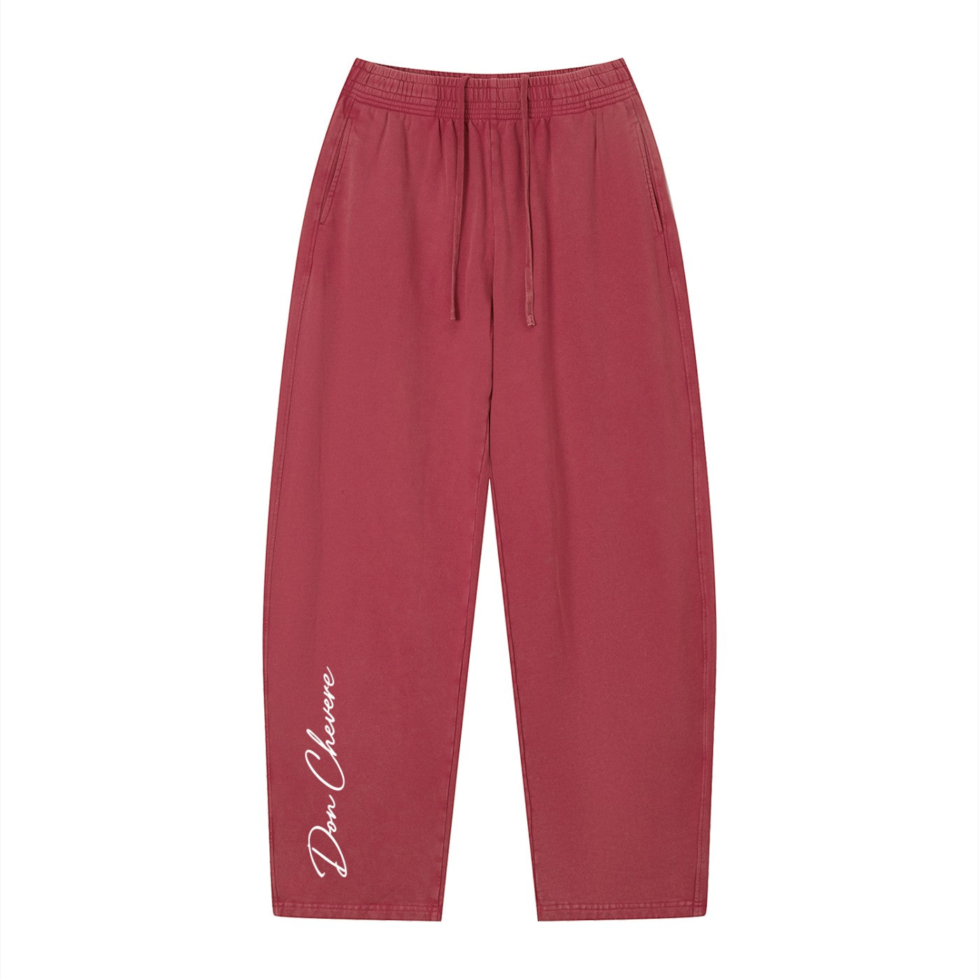 Don Chevere vintage wash loose sweatpants in a dusty rose color, made of 100% cotton with an elastic drawstring waist and side pockets.