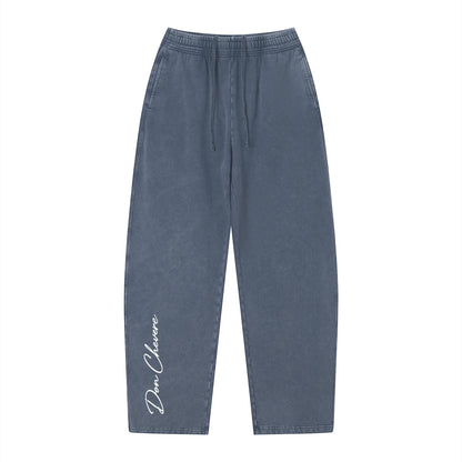 Don Chevere vintage wash loose sweatpants in dark blue, made of 100% cotton with an elastic drawstring waist and side pockets.