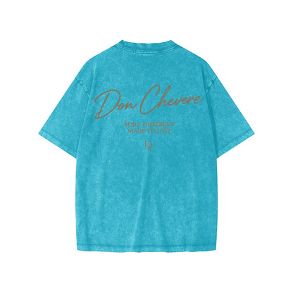 Don Chevere kids' short-sleeve washed teal cotton t-shirt with graphic print on back.