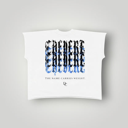Don Chevere white 100% cotton non-shrink raw edge tee with a graphic print and text "THE NAME CARRIES WEIGHT."