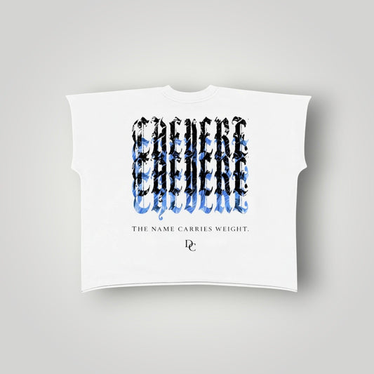 Don Chevere white 100% cotton non-shrink raw edge tee with a graphic print and text "THE NAME CARRIES WEIGHT."